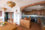 Kitchen / dining area with doors opening to large terrace