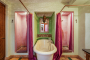 Ground floor bathroom with walk-in showers and bathtub