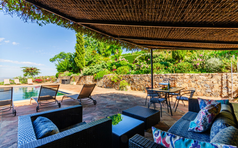 Shaded relaxing area by the swimming pool