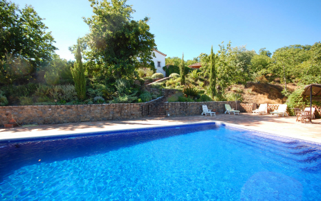 The large private pool is some steps down from the villa